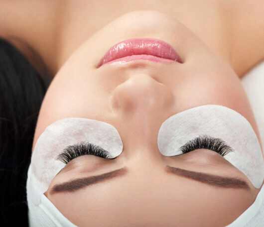 Photo comparison of woman's normal and fake enlarged lashes. Photo comparison of woman's normal and fake enlarged lashes.